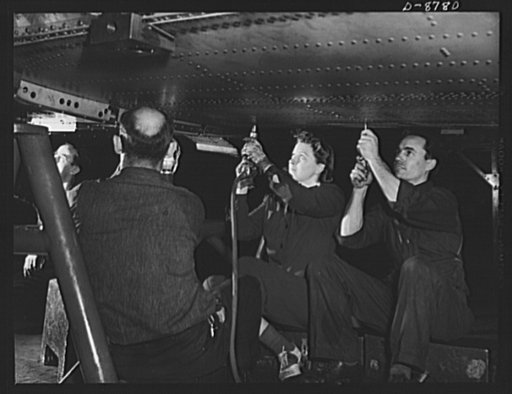 Production. B-24E (Liberator) bombers at Willow Run. Riveting a center wing section for a B-24E (Liberator) bomber in the horizontal position at Ford's big Willow Run plant. The Liberator is capable of operation at high altitudes and over great ranges on precision bombing missions. It has proved its