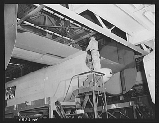 Production. B-24E (Liberator) bombers at Willow Run. Setting the empennage of a new B-24E (Liberator) bomber in place on one of the assembly lines at Ford's big Willow Run plant. The Liberator is capable of operation at high altitudes and over great ranges on precision bombing missions. It has prove