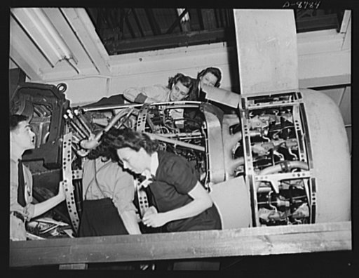 Production. B-24E (Liberator) bombers at Willow Run. Installing one of the four engines of a new B-24E (Liberator) bomber on one of the assembly lines of Ford's big Willow Run plant. The Liberator is capable of operation at high altitudes and over great ranges on precision bombing missions. It has p