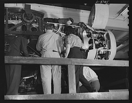 Production. B-24E (Liberator) bombers at Willow Run. Installing one of the four engines of a new B-24E (Liberator) bomber on one of the assembly lines of Ford's big Willow Run plant. The Liberator is capable of operation at high altitudes and over great ranges on precision bombing missions. It has p