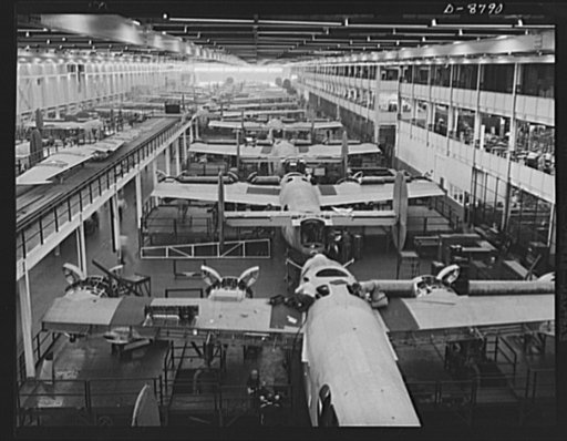 Production. B-24E (Liberator) bombers at Willow Run. Looking down one of the two final assembly lines for B-24E (Liberator) bombers at Ford's big Willow Run plant. Guns and wing tips have not yet been added to the planes in the foreground. The Liberator is capable of operation at high altitudes and 