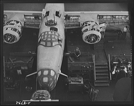 Production. B-24E (Liberator) bombers at Willow Run. Another B-24E (Liberator) bomber nears completion on one of the assembly lines at Ford's big Willow Run plant. A paint job comes next. The Liberator is capable of operation at high altitudes and over great ranges on precision bombing missions. It 