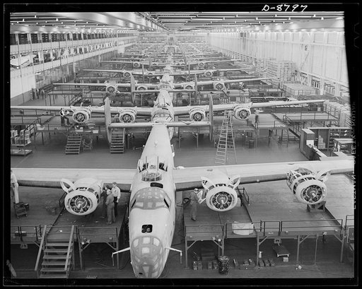 Production. B-24E (Liberator) bombers at Willow Run. Looking up one of the assembly lines at Ford's big Willow Run plant, where B-24E (Liberator) bombers are being made in great numbers. The Liberator is capable of operation at high altitudes and over great ranges on precision bombing missions. It h