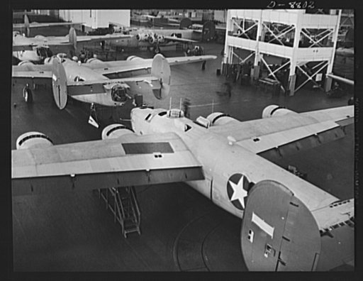 Production. B-24E (Liberator) bombers at Willow Run. New Liberator (B-24E) bombers await paint jobs after coming off the assembly lines at Ford's big Willow Run plant. The Liberator is capable of operation at high altitudes and over great ranges on precision bombing missions. It has proved itself an