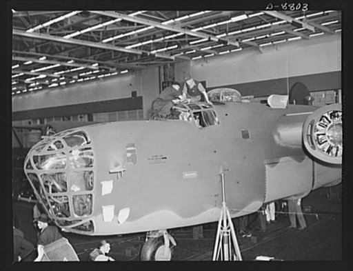 Production. B-24E (Liberator) bombers at Willow Run. Final touch-ups and inspections are made on a new B-24E (Liberator) bomber after it has received a paint job at Ford's big Willow Run plant. The Liberator is capable of operation at high altitudes and over great ranges on precision bombing mission