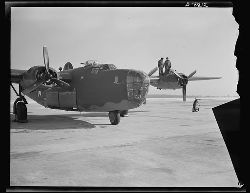 Production. B-24E (Liberator) bombers at Willow Run. A new B-24E (Liberator) bomber, just off the assembly line at Ford's big Willow Run plant, gets a last-minute inspection before taking off on its test flights. The Liberator is capable of operation at high altitudes and over great ranges on precis