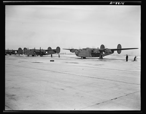 Production. B-24E (Liberator) bombers at Willow Run. New B-24E (Liberator) bombers, just off the assembly lines at Ford's big Willow Run plant, are lined up for test flights before they are accepted by the Army. The Liberator is capable of operation at high altitudes and over great ranges on precisi