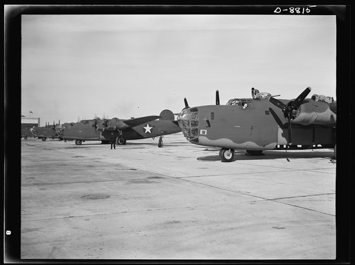 Production. B-24E (Liberator) bombers at Willow Run. New B-24E (Liberator) bombers, just off the assembly lines at Ford's big Willow Run plant, are lined up for test flights before they are accepted by the Army. The Liberator is capable of operation at high altitudes and over great ranges on precisi