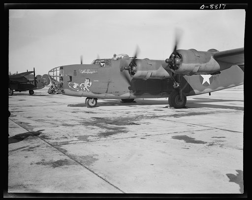 Production. B-24E (Liberator) bombers at Willow Run. A new B-24E (Liberator) bomber, named for Captain Eddie Rickenbacker and bearing his autograph returns to the airfield at Ford's big Willow Run plant after a successful trial flight. The Liberator is capable of operation at altitudes and over grea
