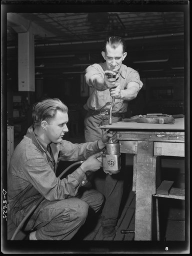 Production. Halftrac armoured cars. Bolting up sections of steel plate that will be used in the production of a body for a halftrac scout car. Great numbers of bodies are turned out in this plant, which formerly made locks and safes. Diebold Safe and Lock Company, Canton, Ohio