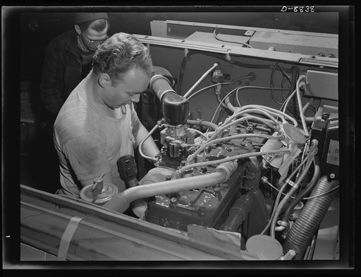 Production. Halftrac armoured cars. The engine of a halftrac scout car receives final inspection as it leaves the assembly line of the plant in which the body was made and mounted. This plant formerly produced locks and safes. Diebold Safe and Lock Company, Canton, Ohio