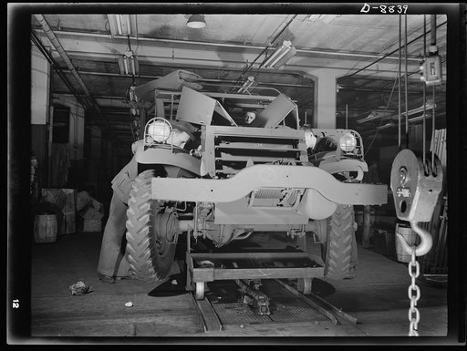 Production. Halftrac armoured cars. Another halftrac scout car leaves a body assembly line in an Eastern plant producing locks and safes. Diebold Safe and Lock Company, Canton, Ohio