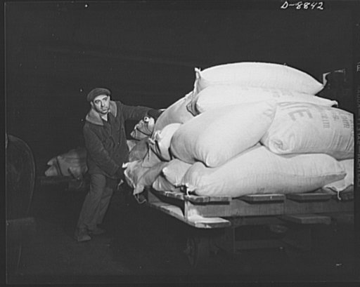 Transportation. Lend-lease shipments. Bags of wheat flour, part of a lend-lease shipment, move from a pier to a United Nations freighter that will carry them together with other vital necessities to one of our allies
