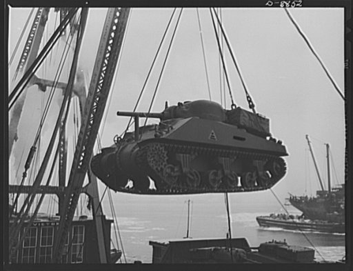 Transportation. Lend-lease shipments. An American M-4 tank coming aboard a United Nations freighter that will carry it, as part of a lend-lease shipment, together with food and other war necessities, to one of our allies