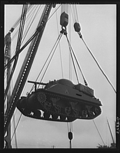 Transportation. Lend-lease shipments. An American M-4 tank coming aboard a United Nations freighter that will carry it, as part of a lend-lease shipment, together with food and other war necessities, to one of our allies