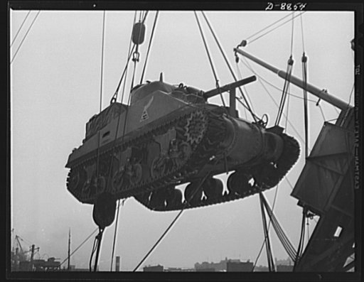 Transportation. Lend-lease shipments. An American M-4 tank coming aboard a United Nations freighter that will carry it, as part of a lend-lease shipment, together with food and other war necessities, to one of our allies