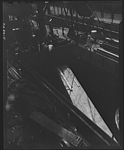 American "steam chickens" arrive in Africa. Up from the hold of a cargo ship, a precious package is hoisted to the deck of an African port. It is an American fighter plane--a P-40 consigned to U.S. and Royal Air Force (RAF) pilots in the African theatre