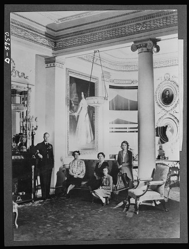 Mrs. Roosevelt at Buckingham Palace. During her recent trip to England, Mrs. Roosevelt stayed with the King and Queen at Buckingham Palace. She is shown here with the royal family in the Bow Room. Left to right: the King, Mrs. Roosevelt, the Queen, Princess Margaret Rose, Princess Elizabeth