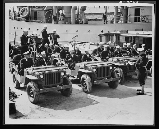 Coast Guard anti-saboteur patrol. "Vital war shipping must be protected on the docks....as well as on the high seas," reads an official order by Vice Admiral Russell R. Waesche, commandant of the U.S. Coast Guard. These armed Coast Guardsmen are shown getting their orders at a East Coast port before