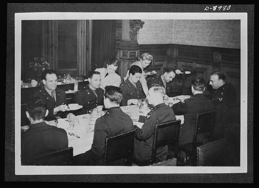 Reciprocal aid. A U.S. officers' mess in England, with girls of the British Women's Auxiliary Air Force serving as waitresses. This service is provided American Army Air Forces under the British Reciprocal Aid Program