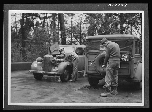 Reciprocal aid. Evidence of British-American cooperation is shown in this picture of U.S. personnel servicing a British Vauxhall and British Humber van, equipment provided American forces under British Reciprocal Aid Program