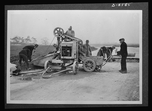Reciprocal aid. A British concrete mixer is employed to prepare a runway for an airfield in Britain for the U.S. Army Air Forces. British labor and material is used in the construction of runways, offices, sleeping quarters and all essential services required for an airport. The facilities are suppl