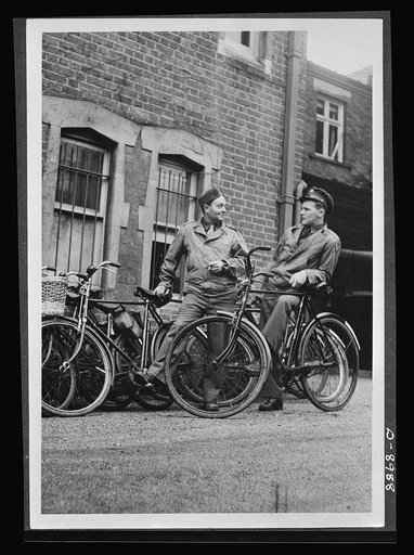 Reciprocal aid. Two Americans, F.F. Calkin, of Cadillac, Michigan, and J. Ferber, of Camden, New Jersey, use their British bicycles for transportation in England. This equipment is part of the supplies and materials furnished American fighting forces under the British Reciprocal Aid Program.