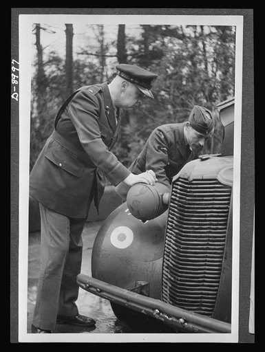 Reciprocal aid. British cars are supplied American air forces in Britain. Lieutenant Taylor, of Stanford, Connecticut, watches an Royal Air Force (RAF) leading aircraftsman service a Vauxhall which is used by U.S. officers. American and British air forces work side by side in the European theatre, w