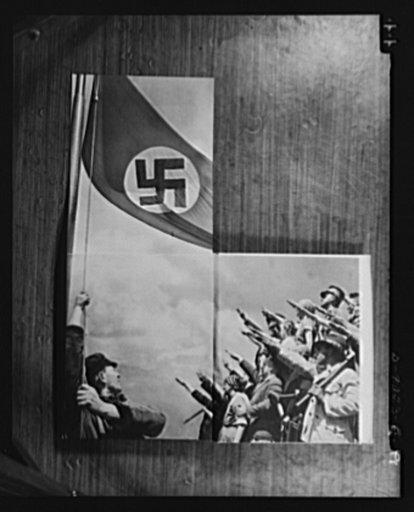 Axis propaganda. The lavishness of Nazi propaganda is illustrated by this book which Elmer Davis, director of the Office of War information, displayed at his press conference on March 6, 1943. After the book is opened at this place, the left page may be opened upward revealing the flag. The picture 