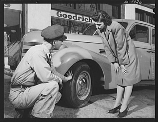 Tire recapping. A service attendant points out a worn tire that may be recapped under a new plan which removes restrictions on reclaimed camelback rubber for passenger tires. The plan to recap passenger car tires with reclaimed rubber camelback, approved by rubber director William M. Jeffers, was pu