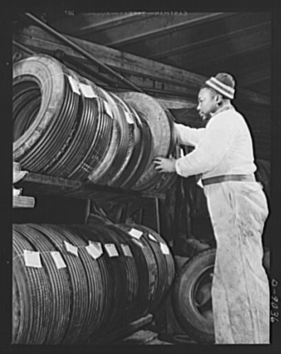 Tire recapping. A newly recapped passenger car tire is put in the "finished" rack to await pickup by the owner. The plan to recap passenger tires with reclaimed rubber camelback, approved by Rubber Director William M. Jeffers, was put into effect in February 1943 to reduce the demand for replacement