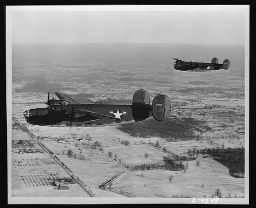 Liberator (B-24E) bomber. Two Liberator (B-24E) bombers on trial flights near the big Ford Willow Run Plant at which they were produced. The Liberator is capable of operation at high altitudes and over great ranges for high accuracy bombing missions. It has proved itself an excellent performer in th
