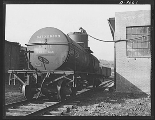Conversion. Rendering of household fats. Tallow made from reclaimed kitchen greases is pumped into a tank car from a storage tank at a rendering plant. From here the tallow goes to a soap factory where glycerin is produced as a byproduct of the soap- making process