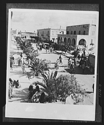 8th Army in Tripoli. Misurata in North Africa, shown from the balcony of its city hall, the morning after the entrance of the British 8th Army. The friendly citizenry go about their daily tasks. Curious men investigate an army truck to the right