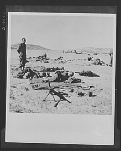 8th Army in Tripoli. Time out on the road to Tripoli for a veteran tank crew of the British 8th Army. Catnapping with their arms close by, and guards posted for lookout duty