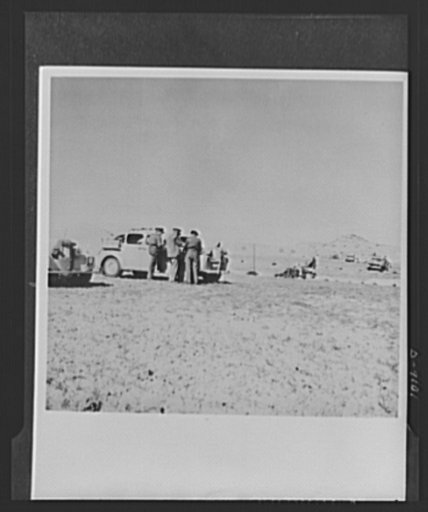 8th Army in Tripoli. Time out on the road to Tripoli for a veteran tank crew of the British 8th Army. Officers use the rest period to consult their maps and routes