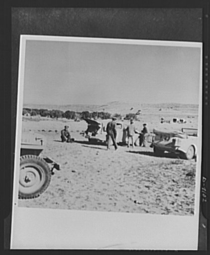 8th Army in Tripoli. Time out on the road to Tripoli for a veteran tank crew of the British 8th Army. Officers use the rest period to consult their maps and routes