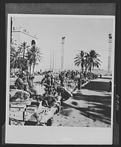 8th Army in Tripoli. Journey's end, for a while. British tanks and crews line up on Tripoli's waterfront after capturing the city