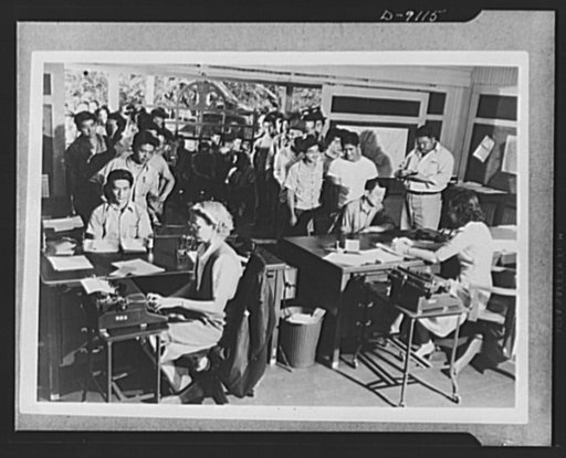 Japanese enlistment. A group of 110 men from the village of Aiea, Territory of Hawaii crowd into Selective Service Board No. 9 in Waipahu. They are waiting to sign applications for voluntary induction into the U.S. Army's recently formed combat regiment composed of 1,500 American citizens of Japanes