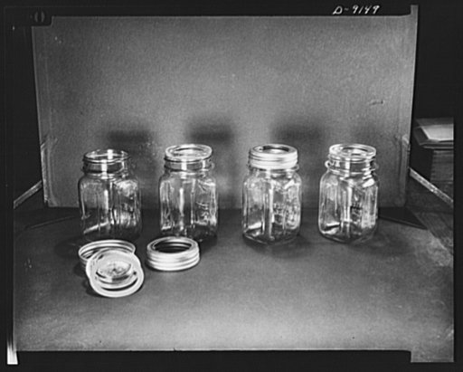 Shown here are the four simple steps in the use of the new lid and metal band closure which will replace the more familiar zinc mason cap--conserving zinc so vitally needed for direct war materials. The Containers Division of the War Production Board (WPB) is encouraging manufacturers to make many m