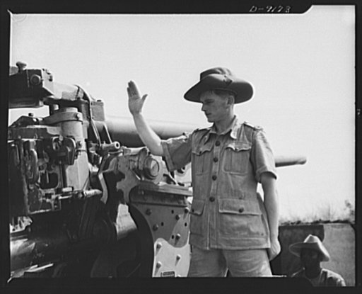 African natives prepare for air attack. Guarding against possible enemy attacks in Africa, crack veterans of the Battle of Britain are instructing African natives in anti-aircraft units. A British non-commissioned officer is shown awaiting the signal to fire as the natives use an Allied plane as pra