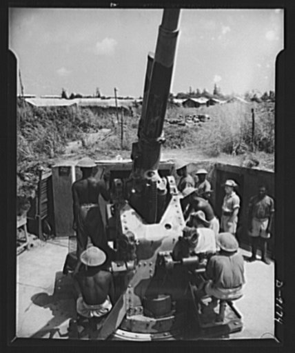 African natives prepare for air attack. Guarding against possible enemy attacks in Africa, British troops are training African natives in anti-aircraft units. The instructors, veterans of the Battle of Britain, have found the natives apt students and cool under fire. An African unit is shown loading