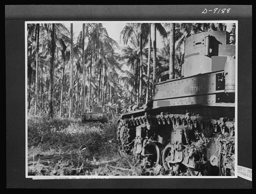 Australia in the war. American tanks manned by Australian crews, demonstrated their fighting strength during the attack on Buna. The tanks crashed through a chain of heavily fortified Japanese pillboxes and Allied infantry followed the tanks in