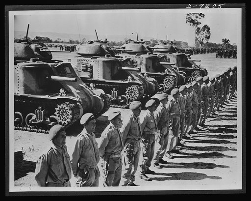 Australia in the war. American medium tanks and their Anzac crews lined up for review at a camp in Australia. Along with other lend-lease equipment, these tanks are helping in the development of a formidable Australian mechanized army