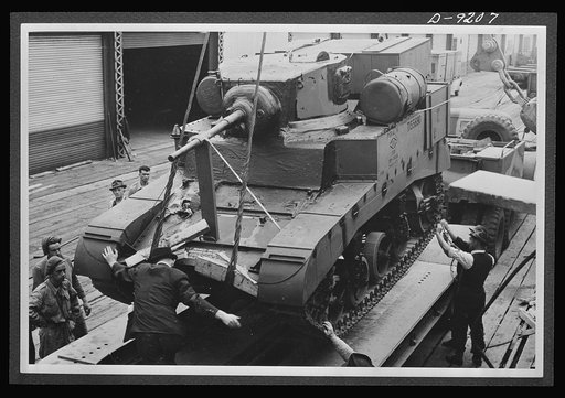 American lend-lease equipment is playing a vital part in the development of United Nations mechanized forces. Here, an American light tank, to be used for training Australia's armored crews, is unloaded at an Australian port
