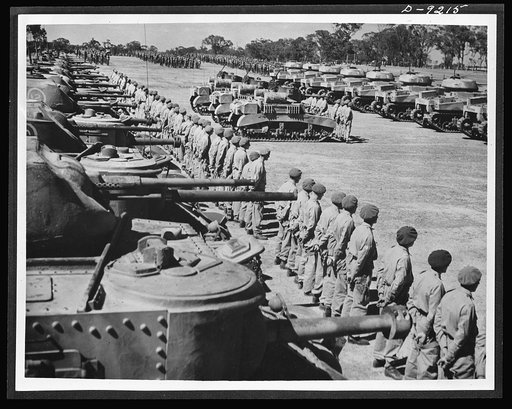 Australia in the war. American medium and light tanks and their Anzac crews lined up for review at a camp in Australia. Along with other lend-lease equipment, these tanks are helping build up Australia's armored forces