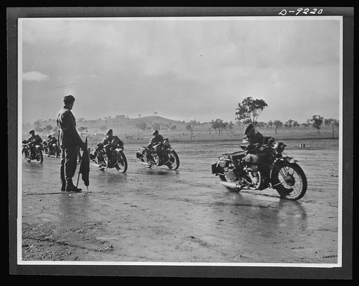 Australia in the war. Australian dispatch riders, equipped with American motorcycles, stage a demonstration during a review at their camp somewhere in Australia