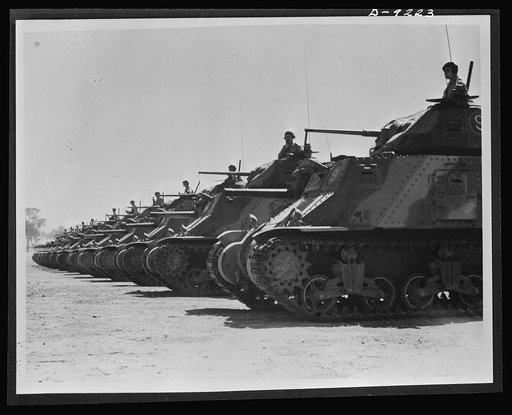 Australia in the war. American medium tanks and their Anzac crews lined up for review at a camp in Australia. Along with other lend-lease equipment, these tanks are helping in the development of a formidable Australian mechanized army
