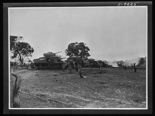 Australia in the war. American tanks, furnished under lend-lease, contribute to building up of Australia's armored forces. These are medium tanks lined up on the range ready for practice