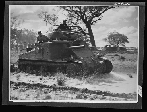 Australia in the war. An American tank, manned by Australian troops is subjected to conditions it is likely to encounter in actual battle during training exercises of the Australian armored forces